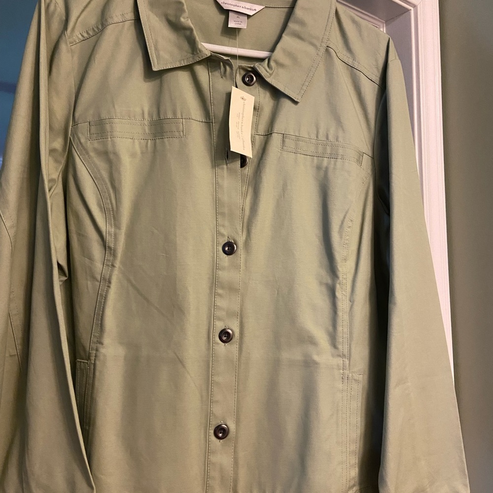 Sage green jacket/shirt.